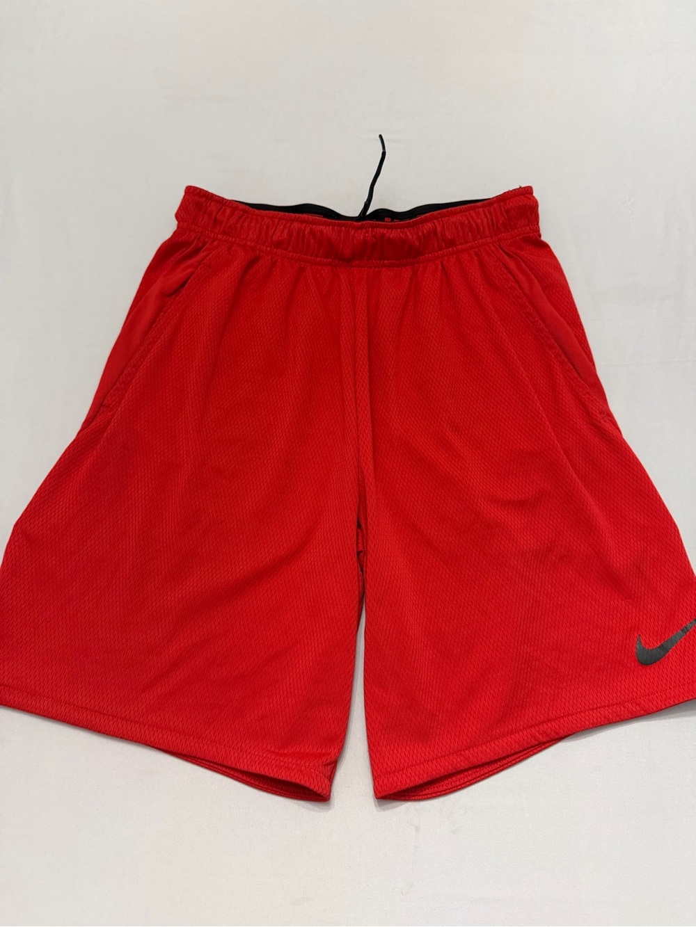 Nike Men's Red Athletic Mesh Shorts with Black Swoosh